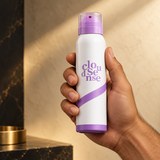 White and lavender spray bottle in hand